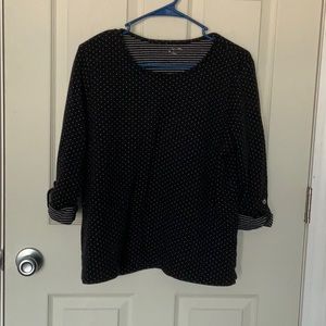 Three-quarter sleeve polkadotted shirt.